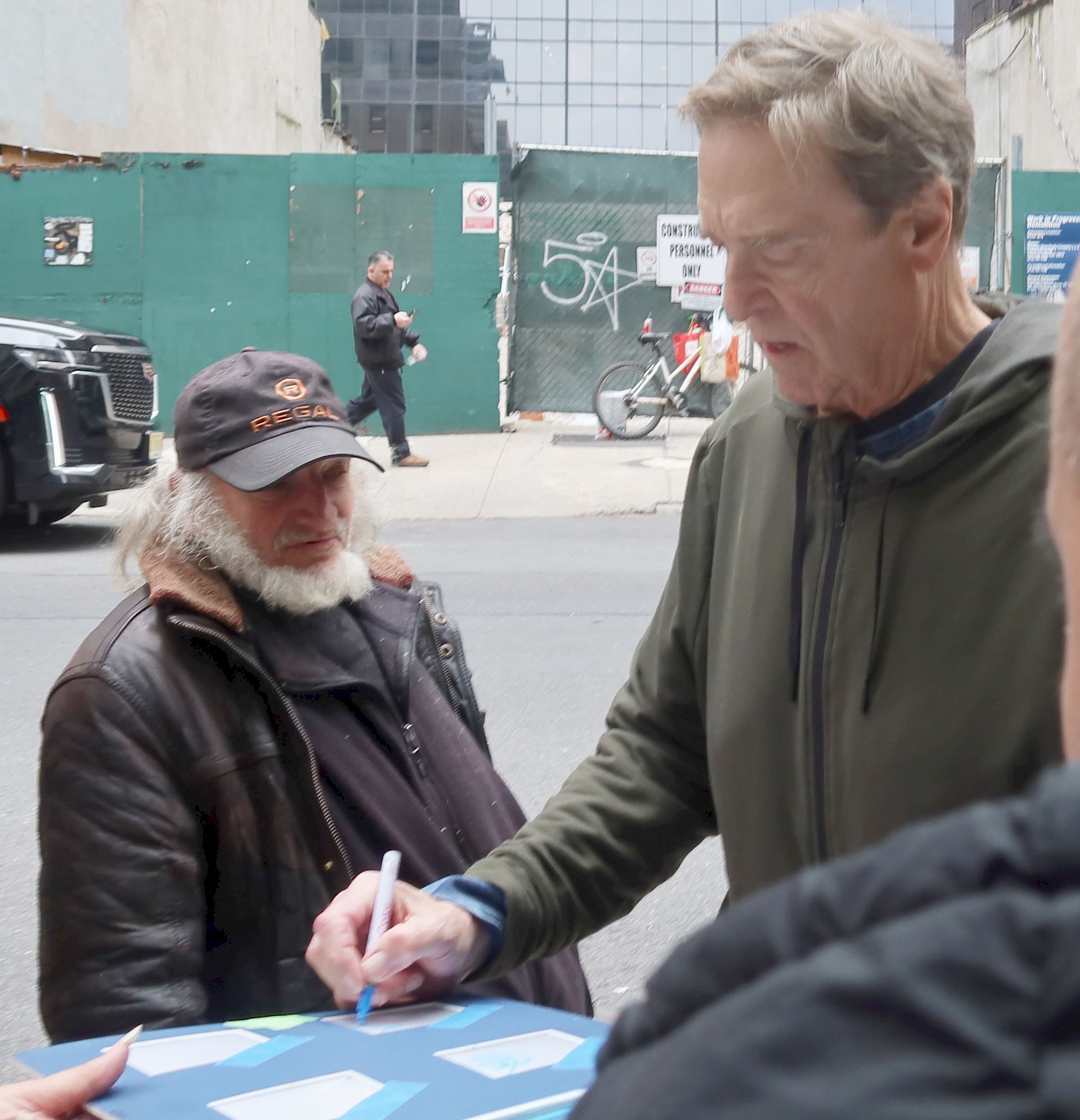 On Wednesday, John was seen signing autographs for fans
