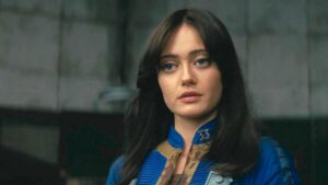 Lucy MacLane in her blue suit in Fallout's ending scenes