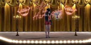 A woman comic performs on stage with the words "Joker the Harlequin" in neon behind her.