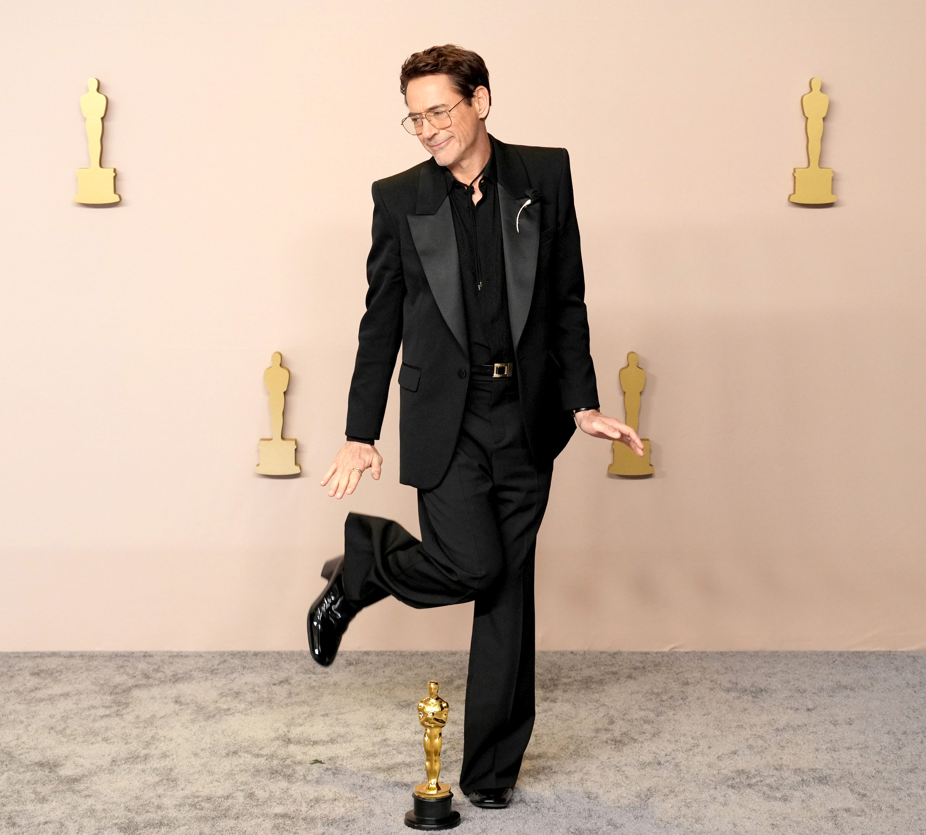 Robert sported similar, high-heeled footwear at the 2024 Oscars, where he paired the shoes with a black tux and a bolo tie
