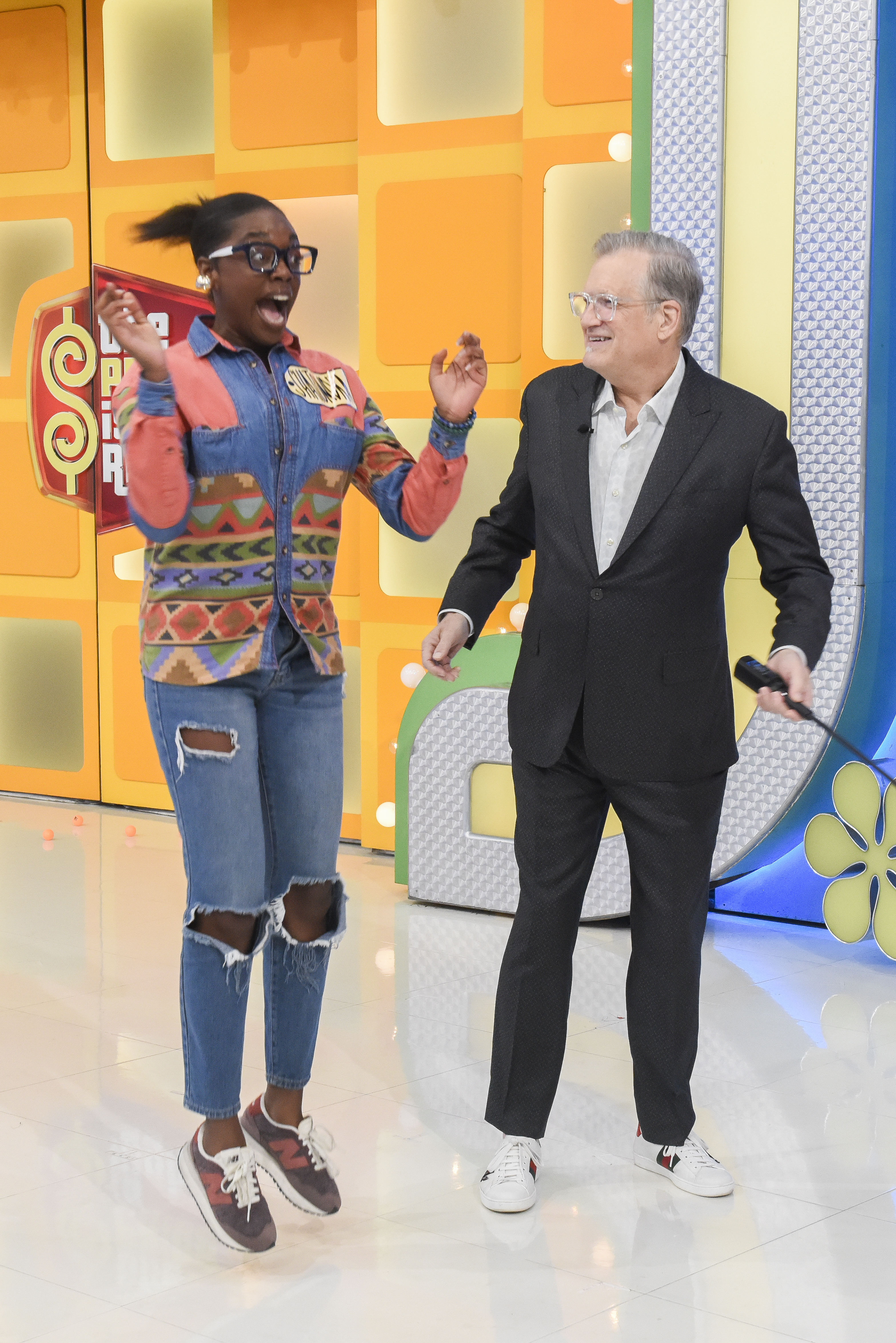 Drew Carey pictured with an overexcited contestant on The Price is Right Set
