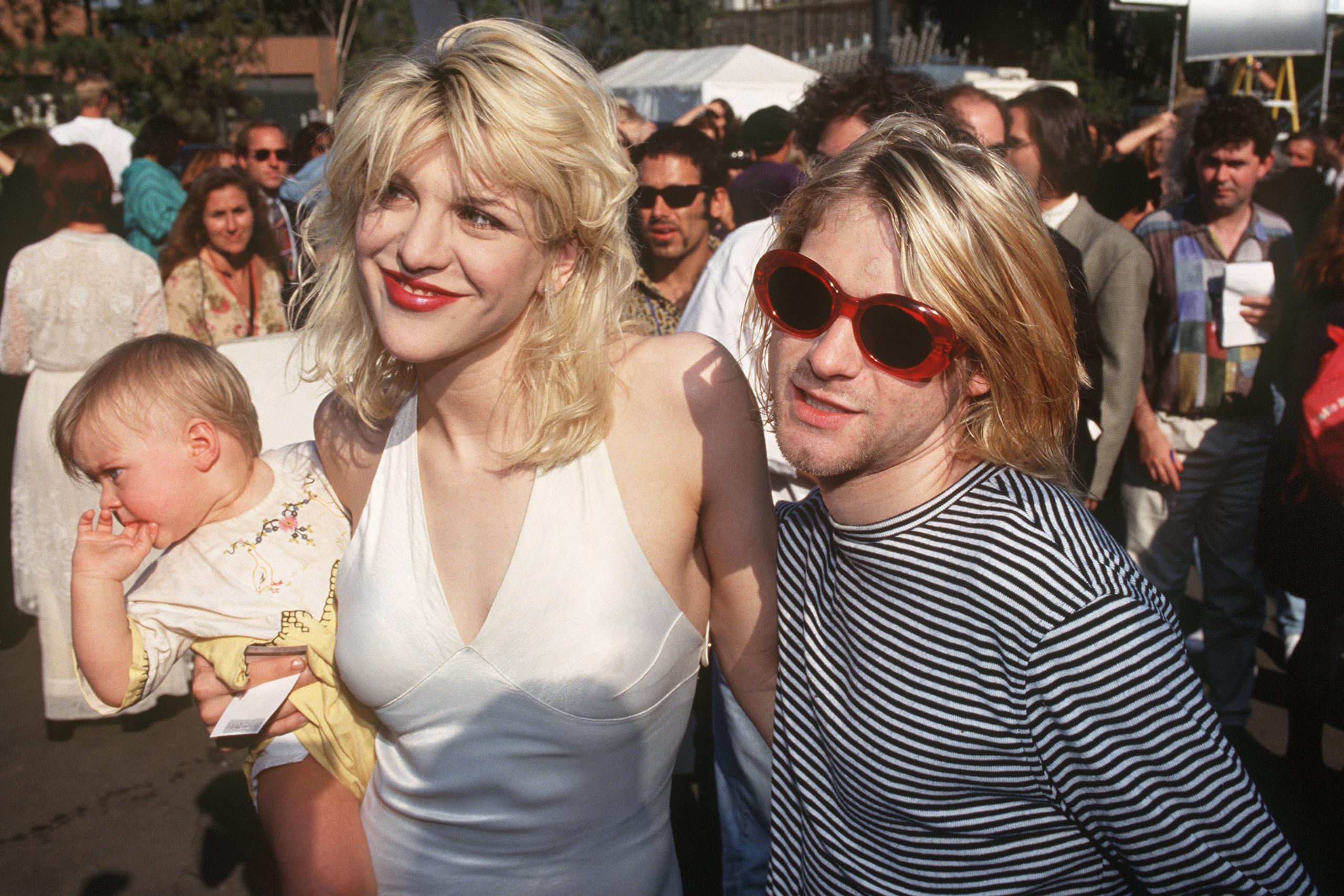  Courtney and Kurt Cobain with their daughter Frances in 1993