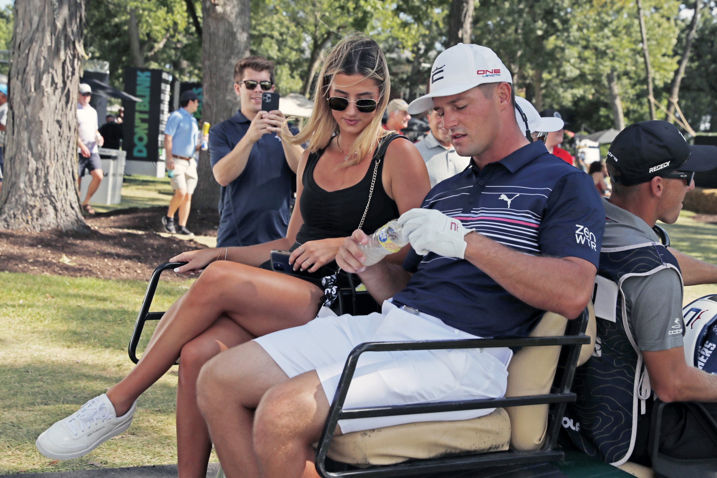 LIV golfer Bryson DeChambeau with his girlfriend Hunter Nugent in a golf cart at the LIV Golf Invitational Series Chicago at Rich Harvest Farms in Sugar Grove, Illinois
