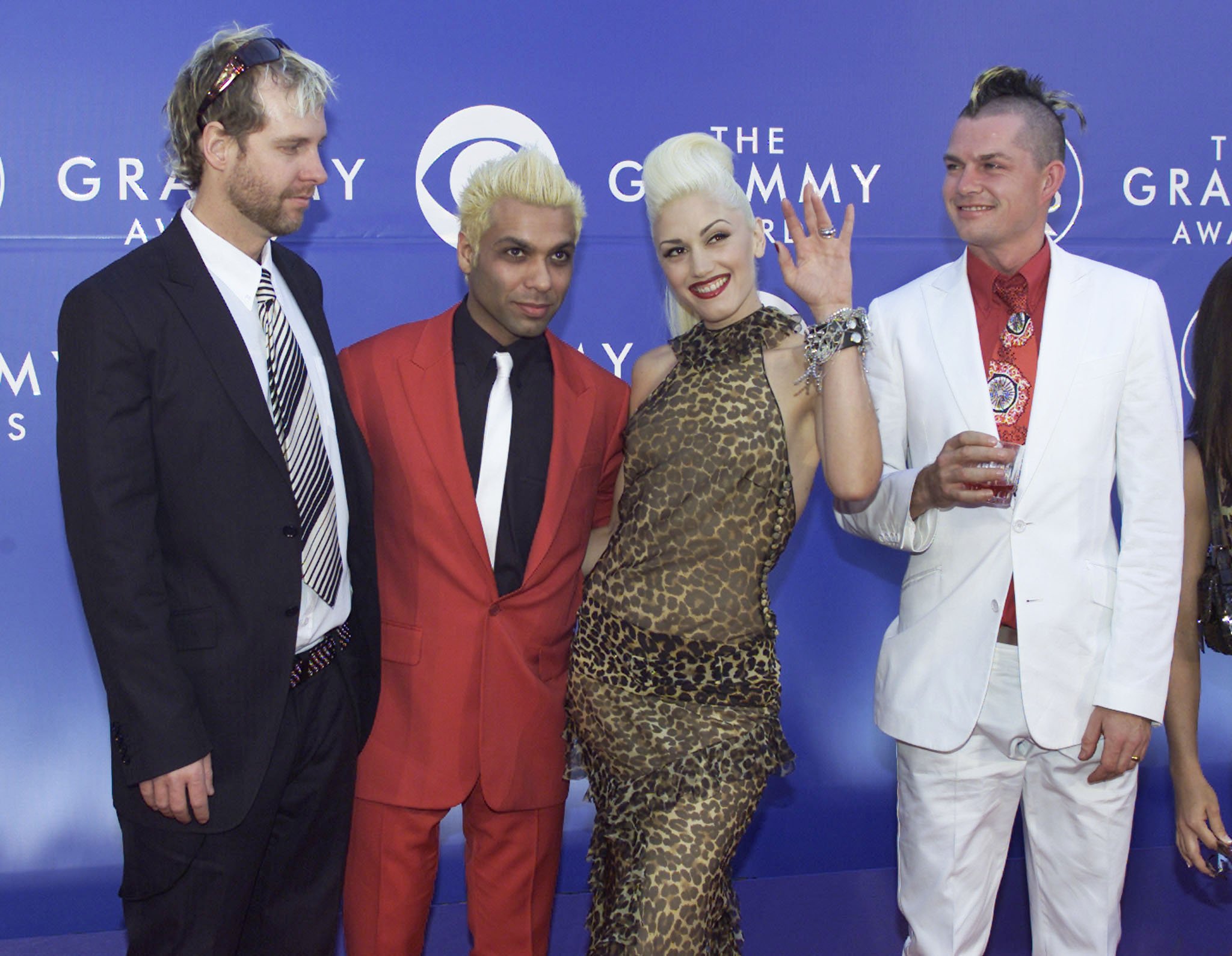 Adrian, Tom, Gwen, and Tony pose for a group photo at an event in February 2002