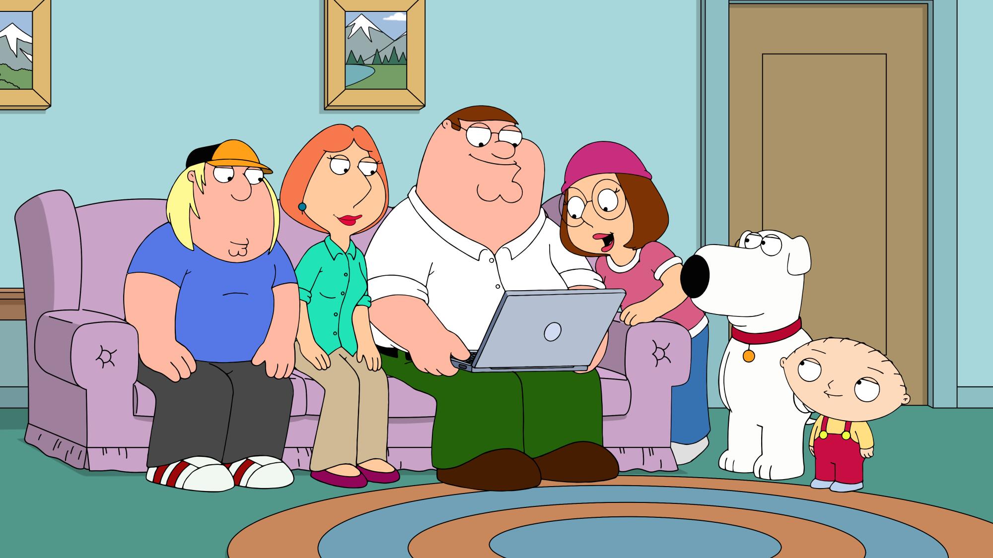 An animated family sits on a couch and looks at a laptop computer screen.