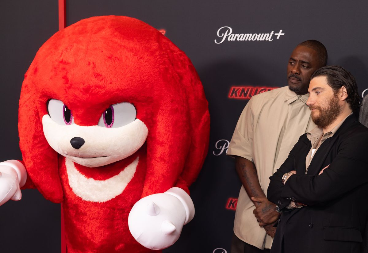 Idris Elba and Adam Pally look worried about Knuckles at the premiere