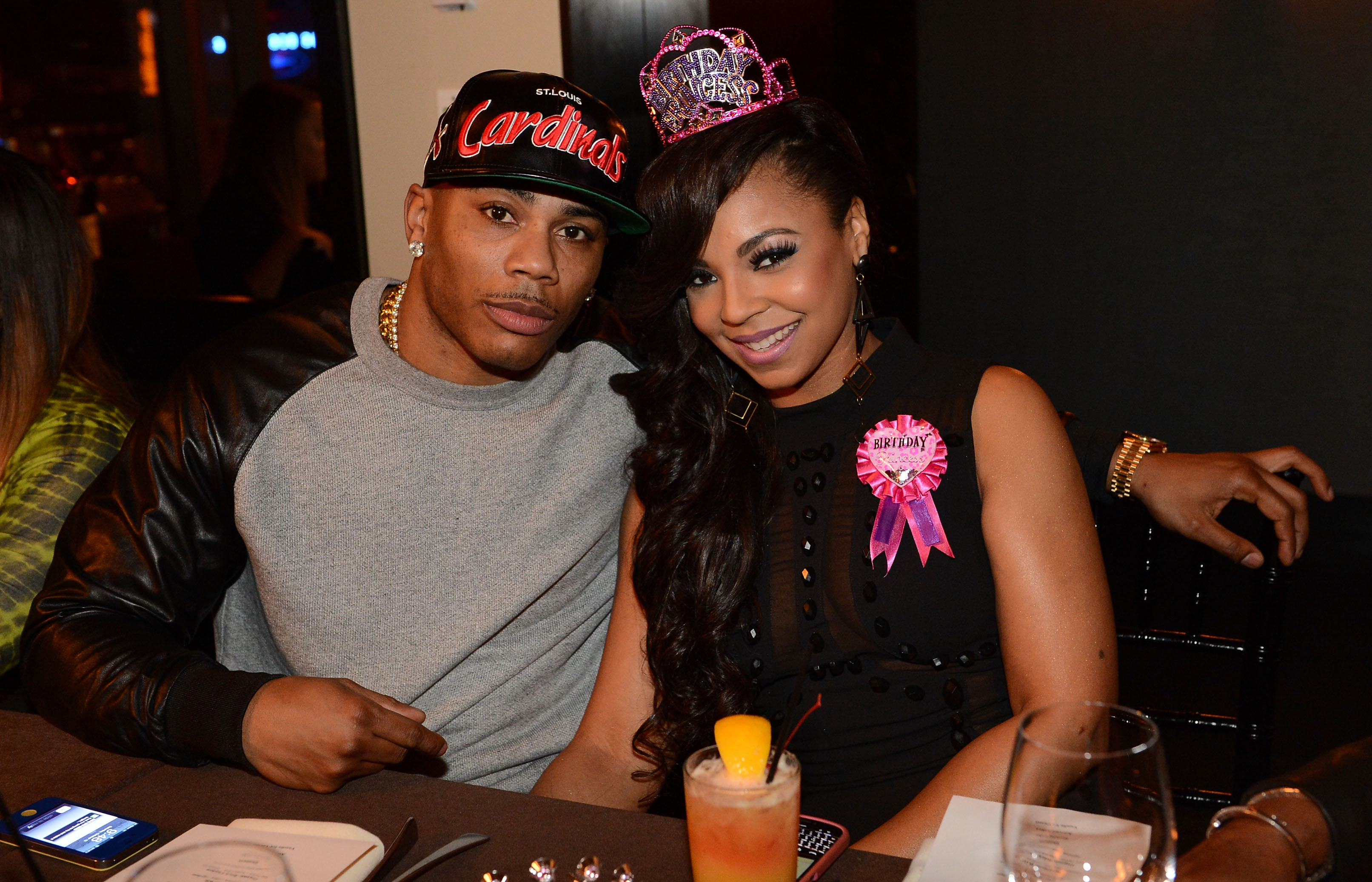 Nelly and Ashanti celebrating the singer's birthday on October 13, 2012