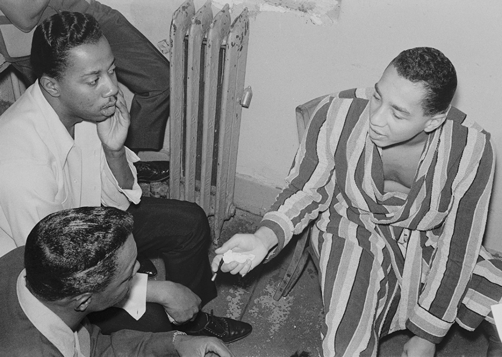 Smokey Robinson rehearses the song 'My Girl' with the Temptations in their dressing room at the Apollo Theater.