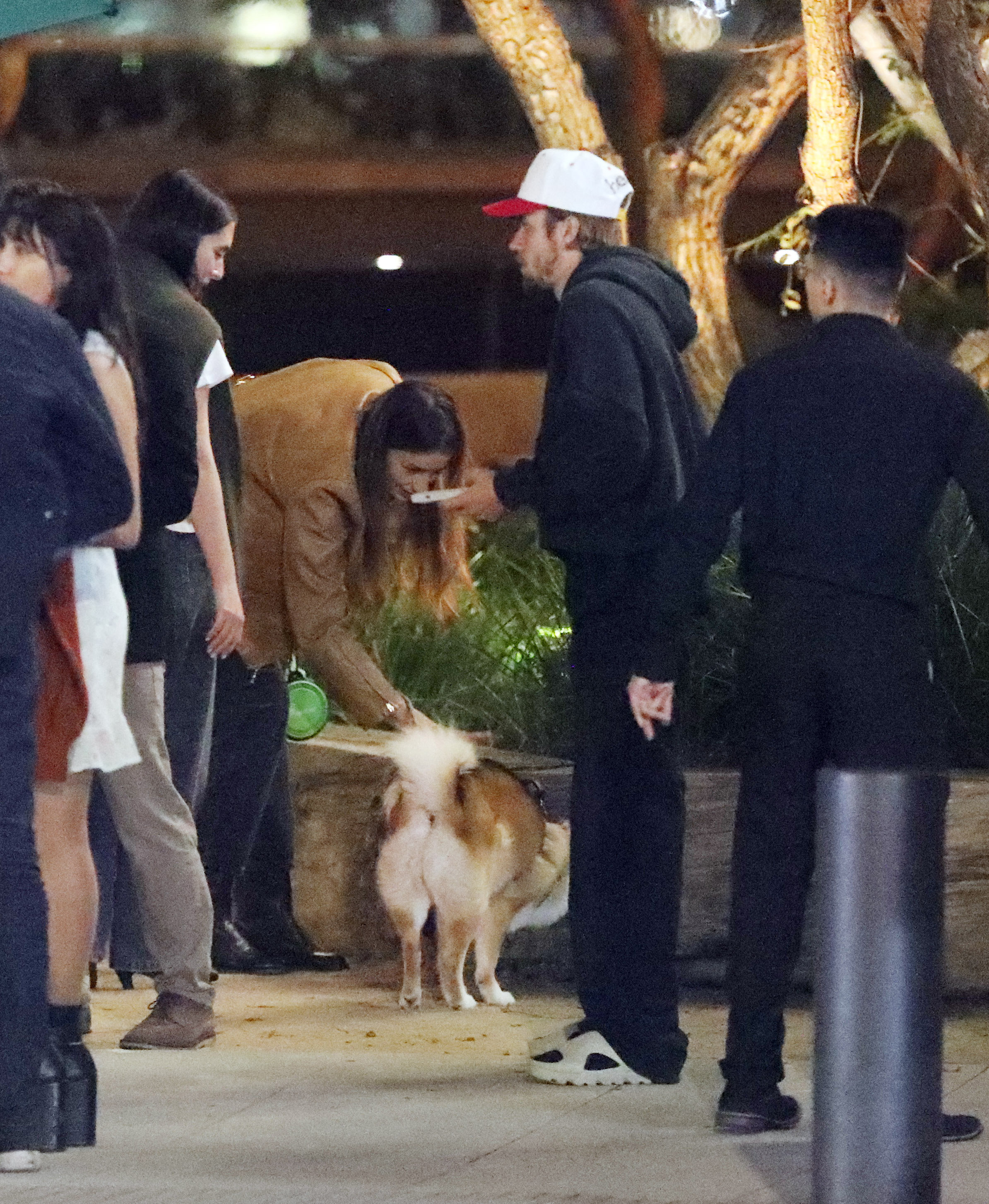 Photos showed the duo reunited with their friends, as Justin socialized with the group