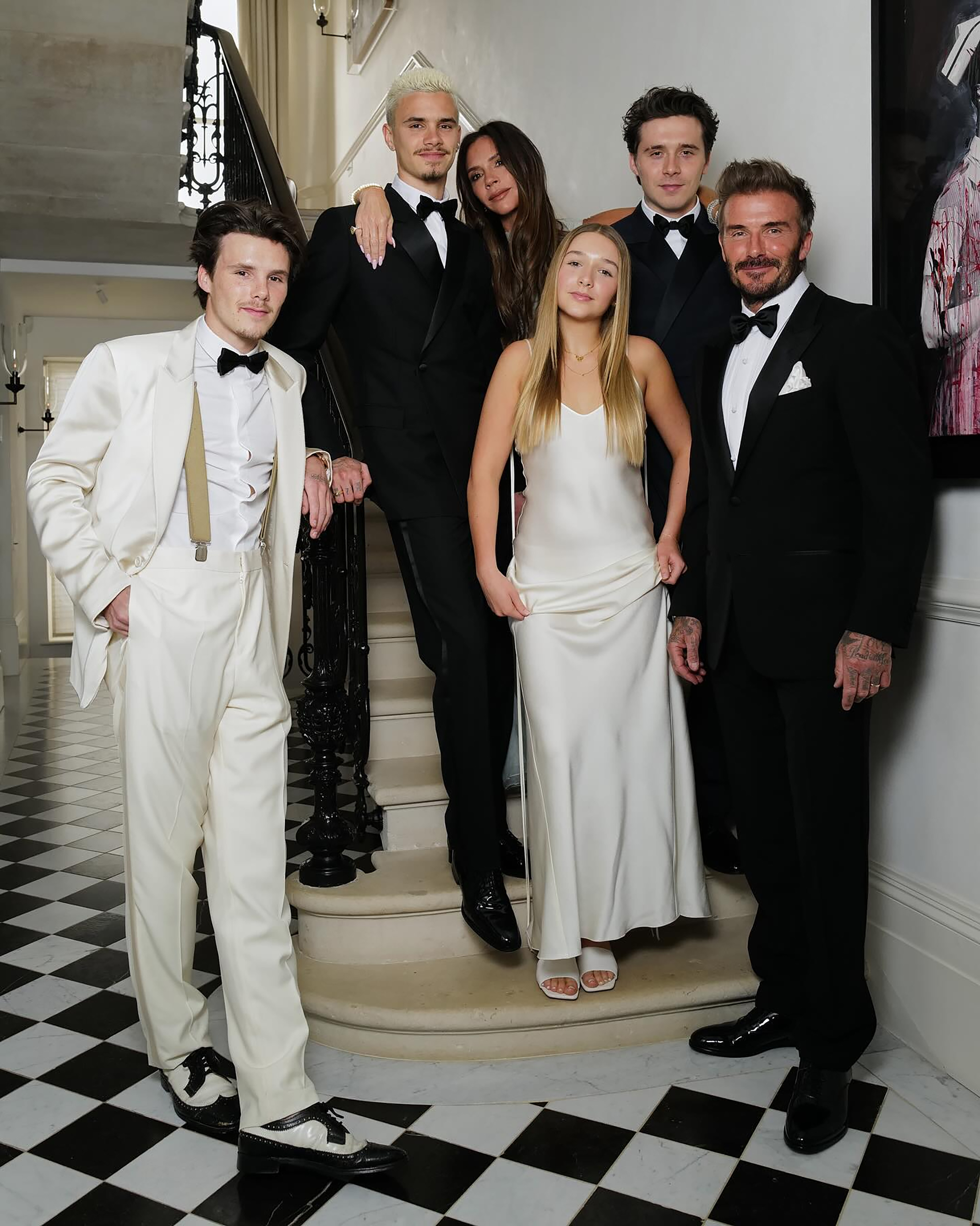 The Beckhams were all smiles as they stood together for photographers at the exclusive Oswald’s venue last night