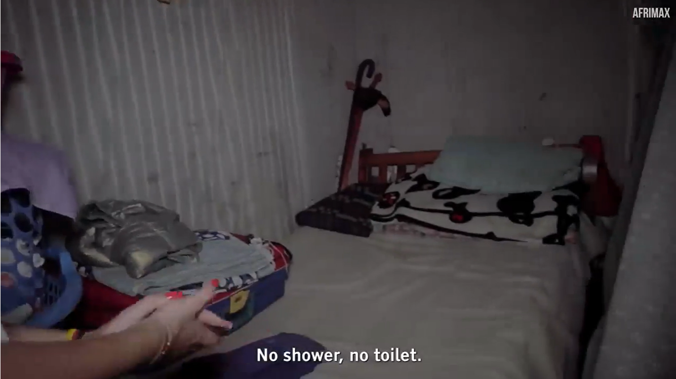 The slum home had just one small bed and no bathroom