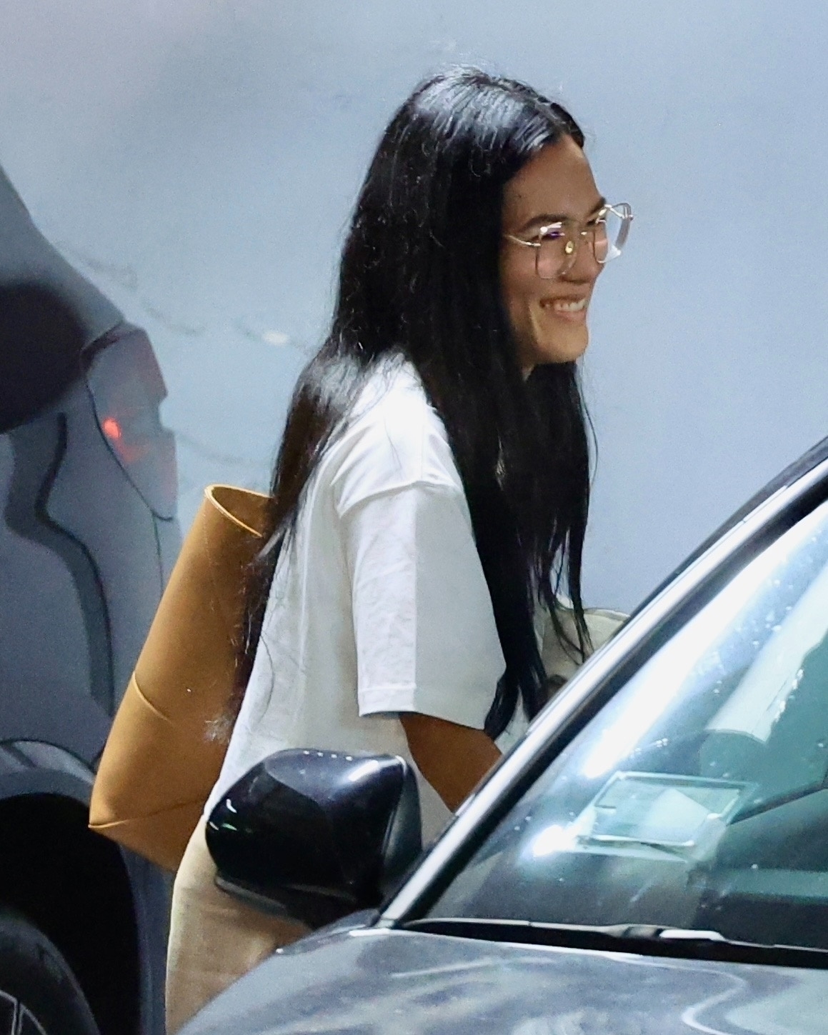 Ali was smiling all the way to the car as they left Sushi Park in West Hollywood