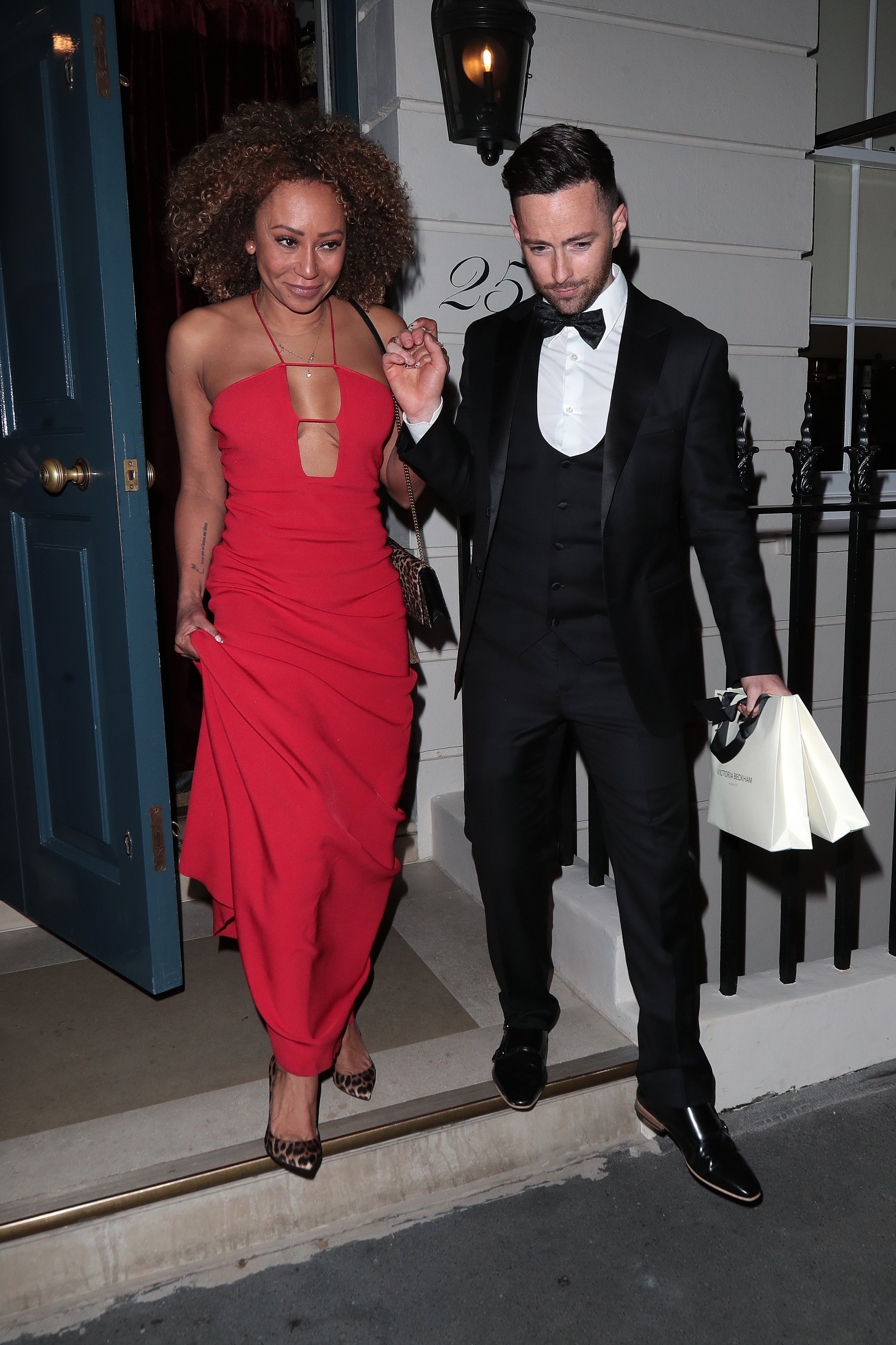Mel leaves the party in the small hours with new partner Rory Mcphee
