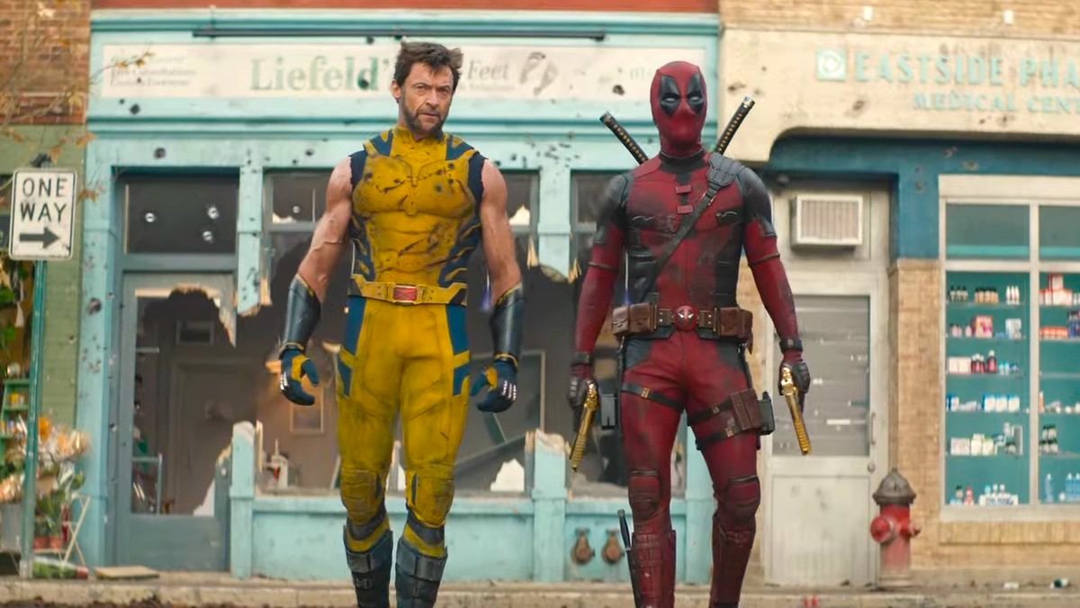 Hugh Jackman and Ryan Reynolds walk down a street in Deadpool & Wolverine