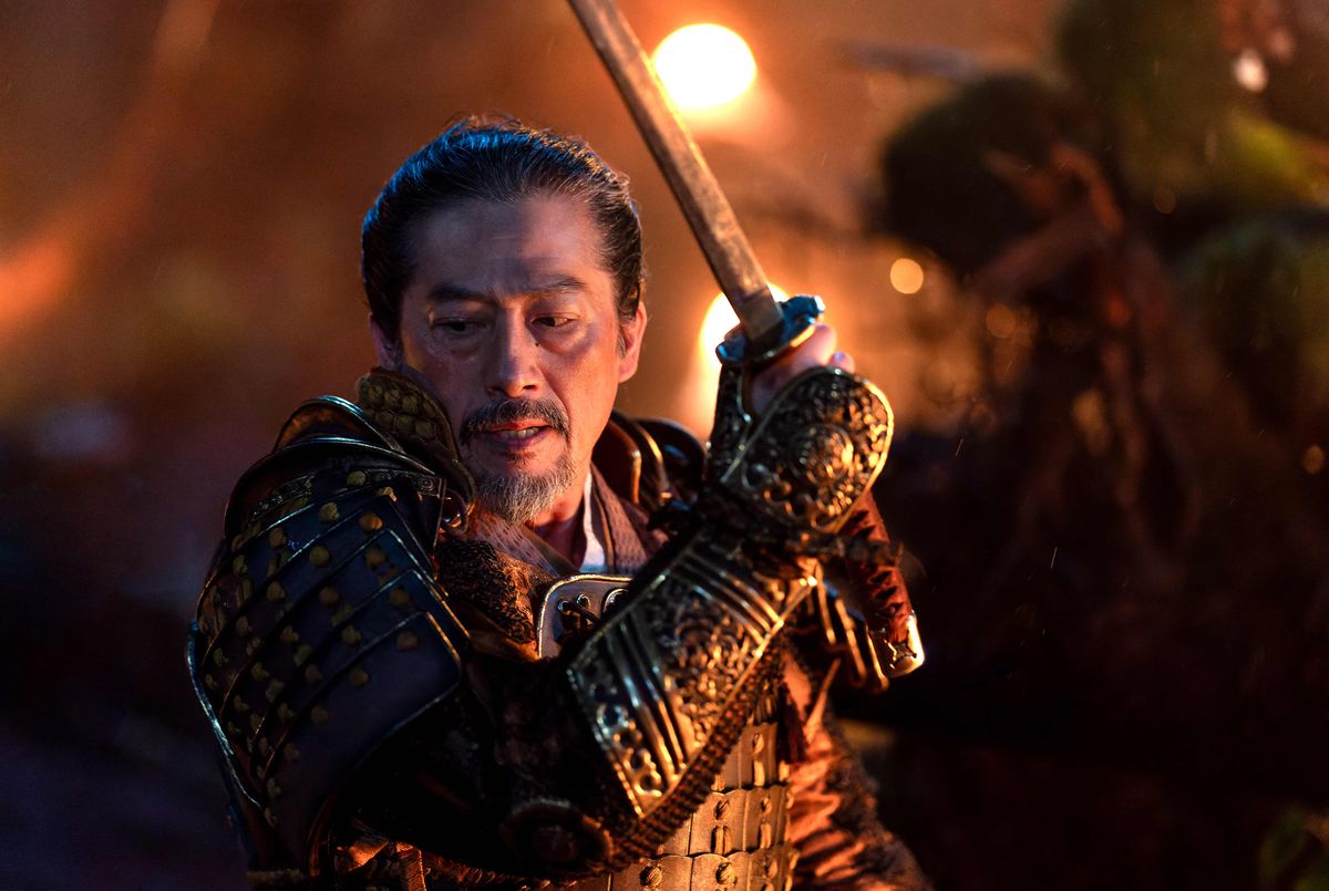 Hiroyuki Sanada holds up a sword while wearing armor in Shogun