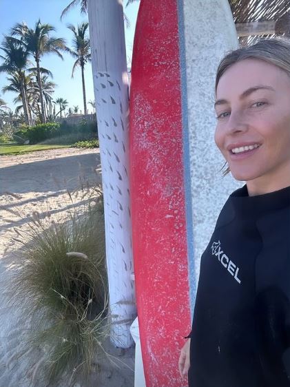 Julianne also shared a photo of her about to surf at the beach