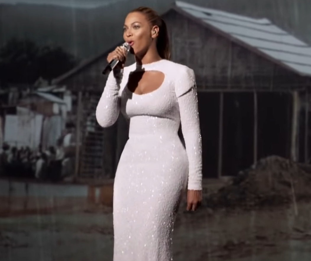 The Queen Bee herself, Beyonce, belts out a song for World Humanitarian Day in 2012 while wearing a glam Bouwer gown