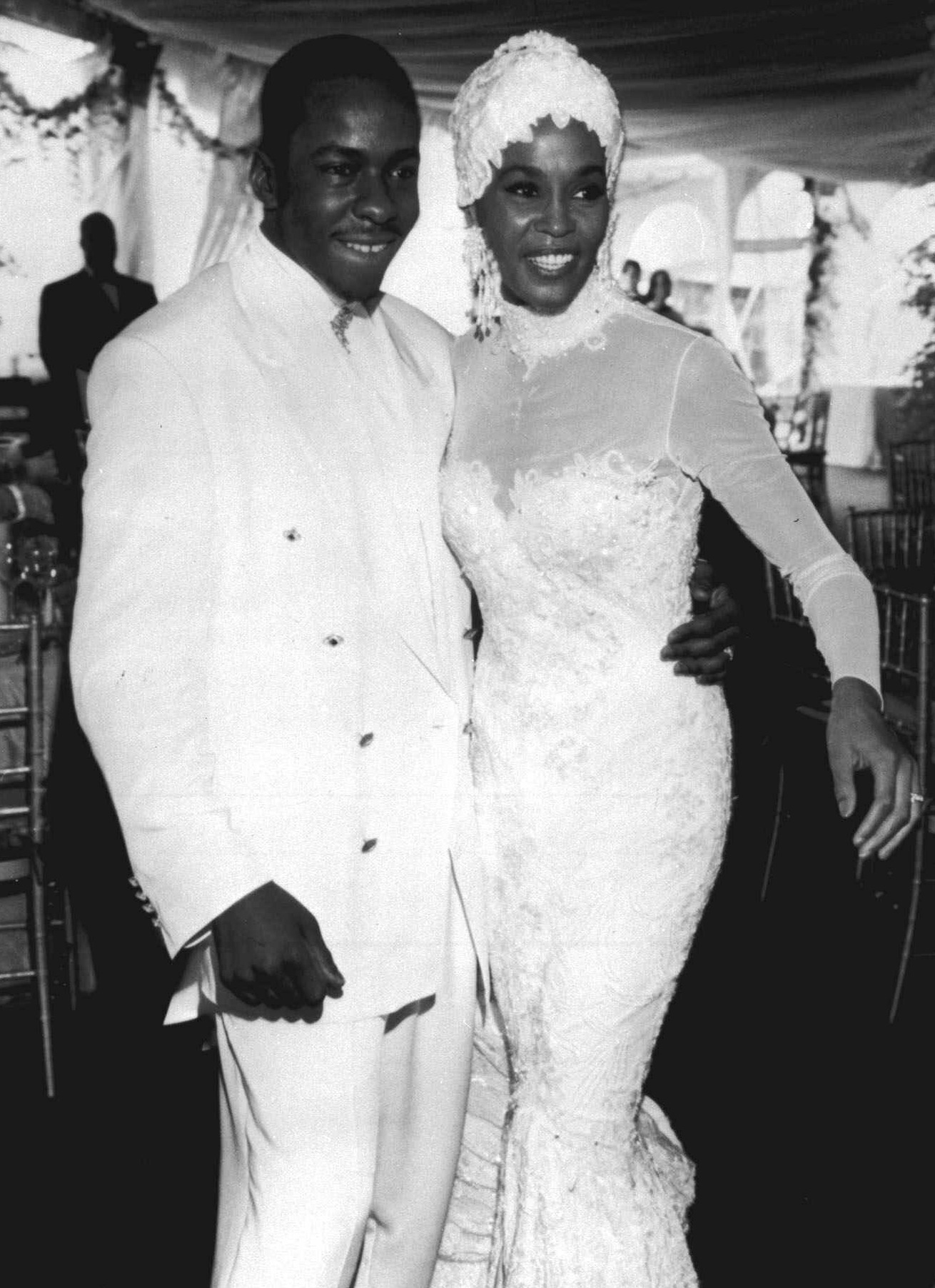 The South African-born Bouwer designed Houston's wedding gown for her 1992 nuptials to Bobby Brown