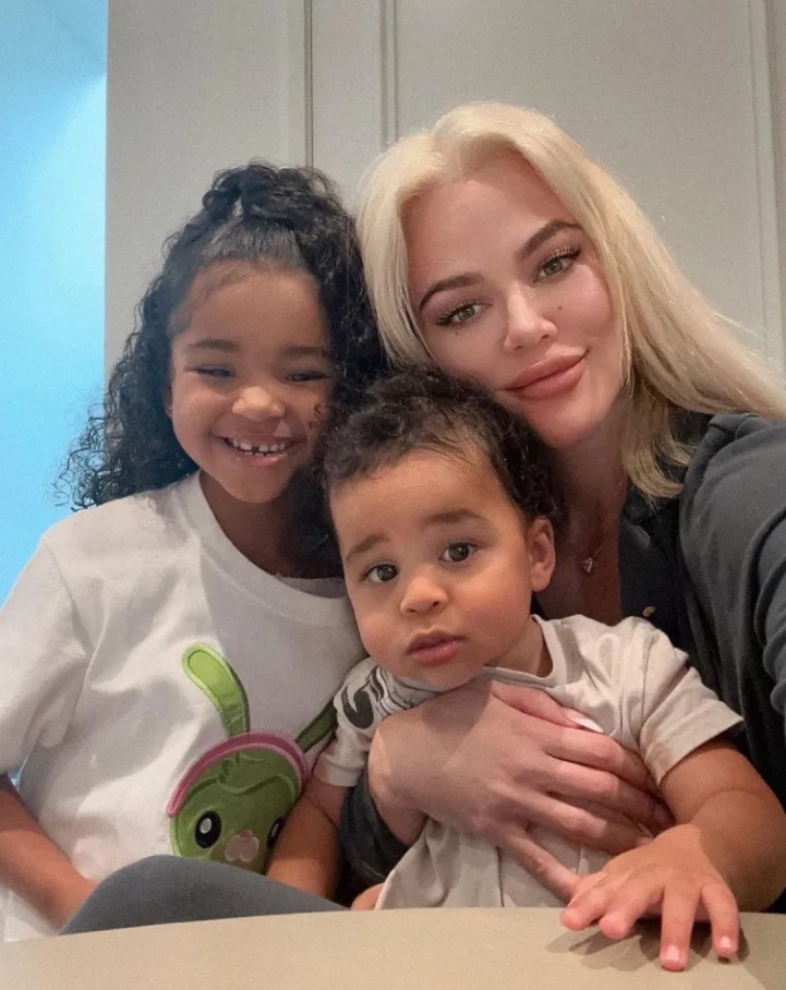 Khloe posed with her two children, Tatum and True, back in December 2023