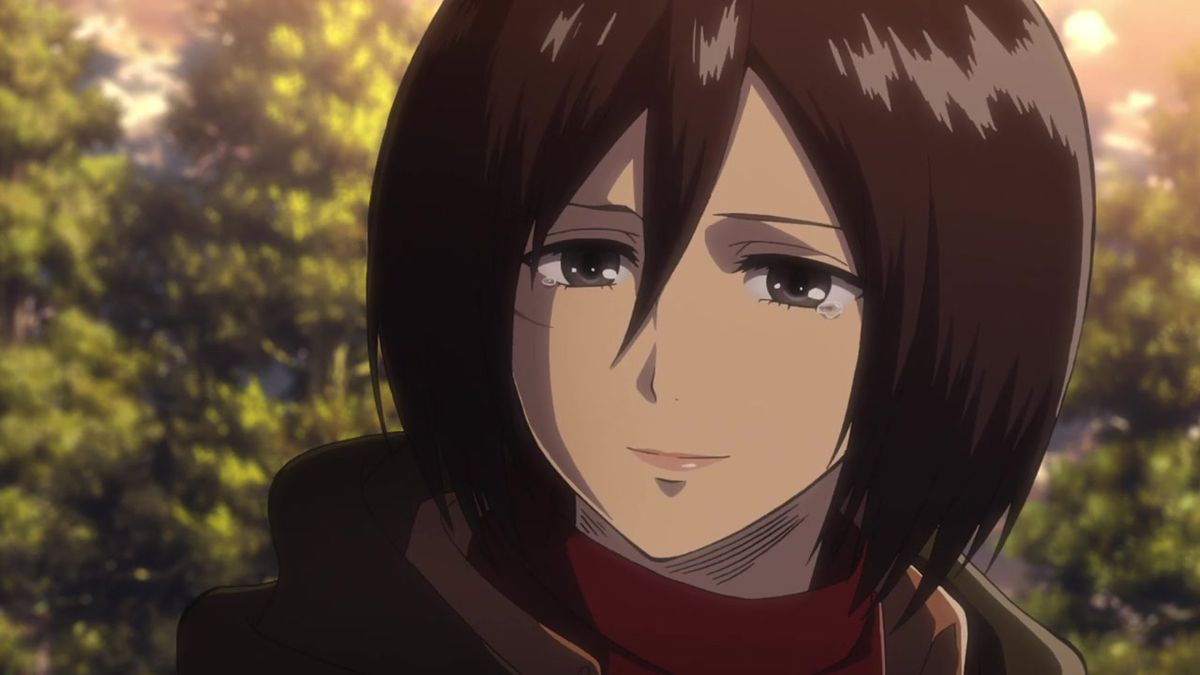 A dark haired anime woman smiles with tears in her eyes and a burgundy scarf draped around her neck.
