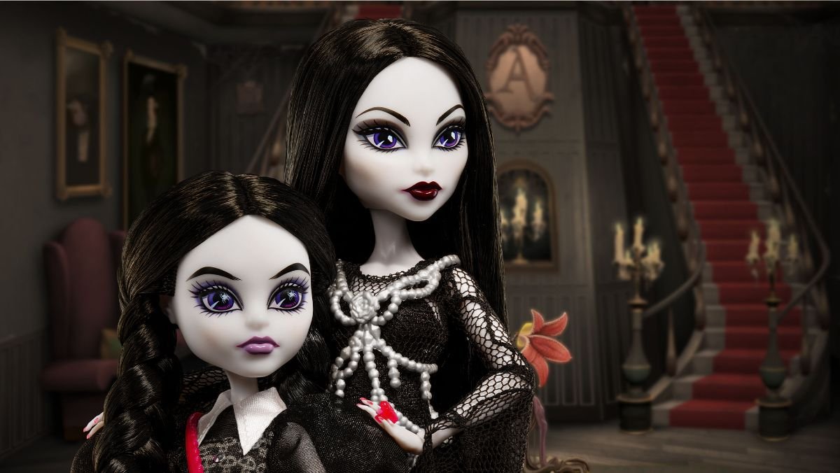 close face image of wednesday and morticia addams monster high dolls