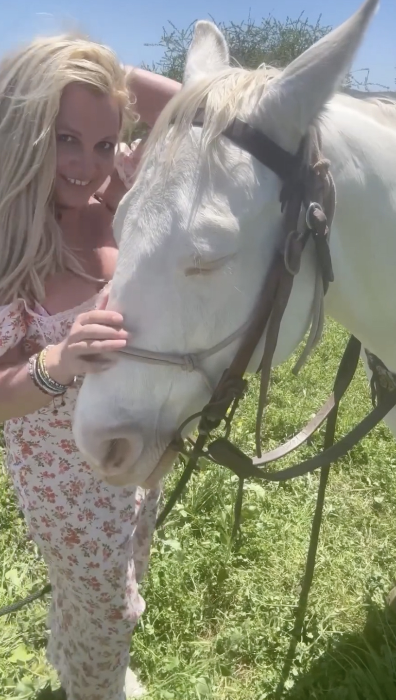 Britney also petted and kissed her horse before stripping down to her bathing suit