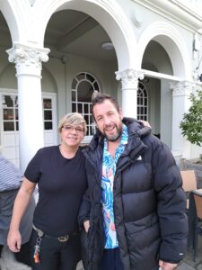 Hollywood superstar Adam Sandler poses with staff at a modest Greene King pub in Whitton, South West London
