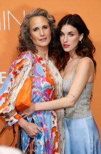 Andie MacDowell and daughter Rainey Qualley attend the Marc Cain Fashion Show Fall/Winter 2023 January 18, 2023 in Berlin, Germany.