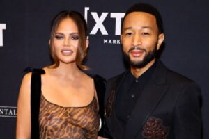 chrissy-teigen-steps-out-in-see-through-animal-print-dress-in-daring-red-carpet-appearance