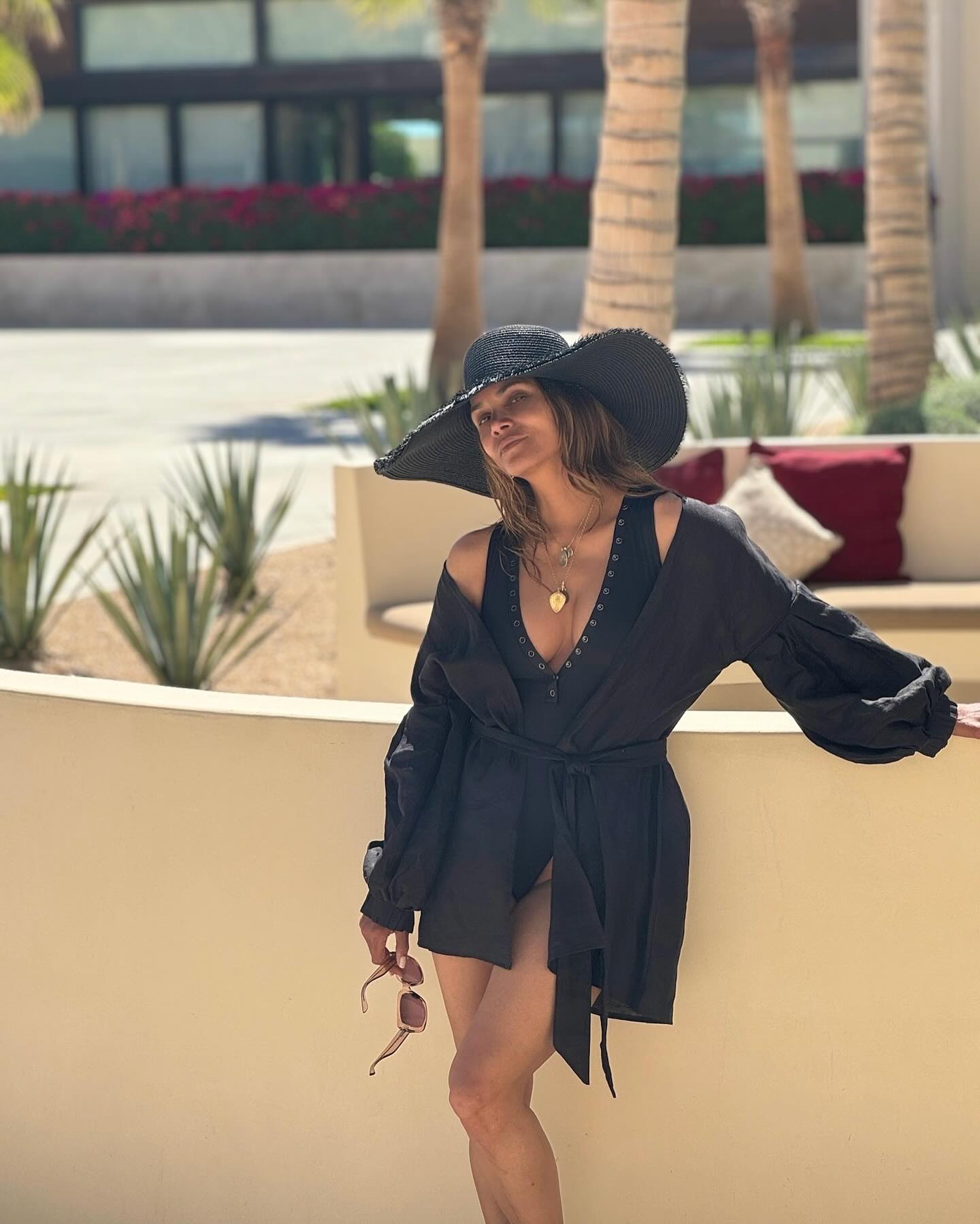 Halle Berry, 57, stuns in plunging black swimsuit on Cabo vacation as ...