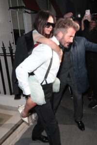 David Beckham gives wife Victoria a piggy back at the end of the night
