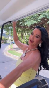 Katy Perry flaunted her figure as she rocked glam dresses in a video from Hawaii