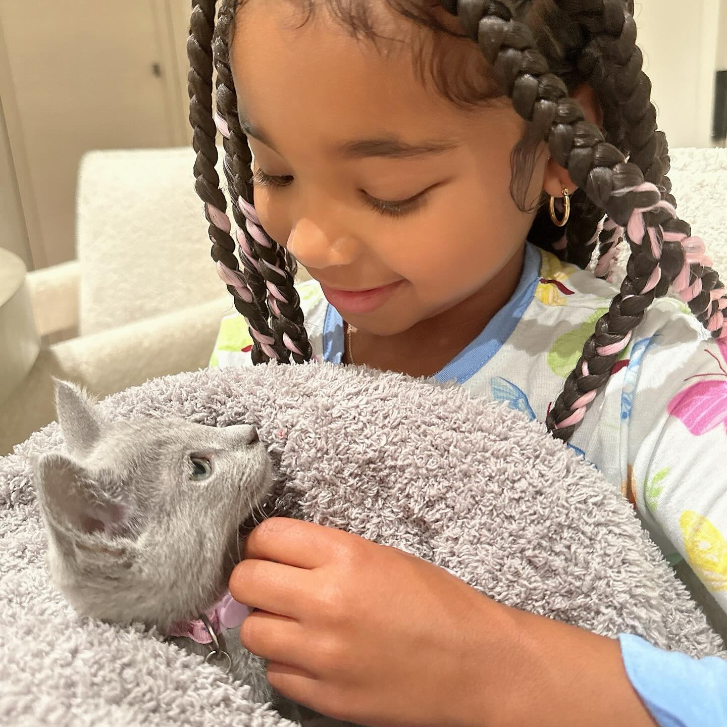 True Thompson held her new pat cat, Baby Kitty, for her sixth birthday