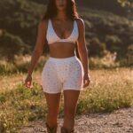 Kim Kardashian shared new photos of her latest Skims spring pieces consisting of a floral-patterned bra and boxers set