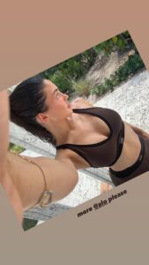 Kylie Jenner takes a selfie in her All Yoga workout set.