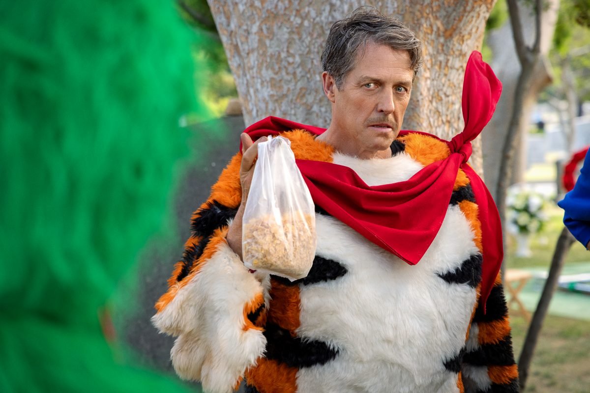 Hugh Grant as Tony the Tiger in Jerry Seinfeld Pop-Tarts movie Unfrosted holding cereal, for Netflix plans to stop sharing subscriber numbers article.