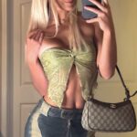 Olivia Dunne snaps a selfie to show off her outfit.