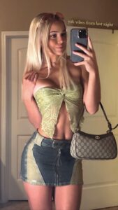 Olivia Dunne snaps a selfie to show off her outfit.
