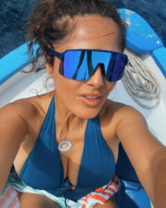 Salma Hayek has looked like she's aging backward as the Hollywood star flaunted her figure in a blue swimsuit
