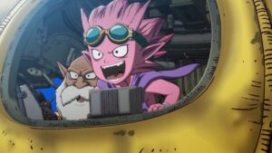 A pink anime boy wearing goggles and an old man with a white beard stare excitedly out of the porthole of a yellow tank.