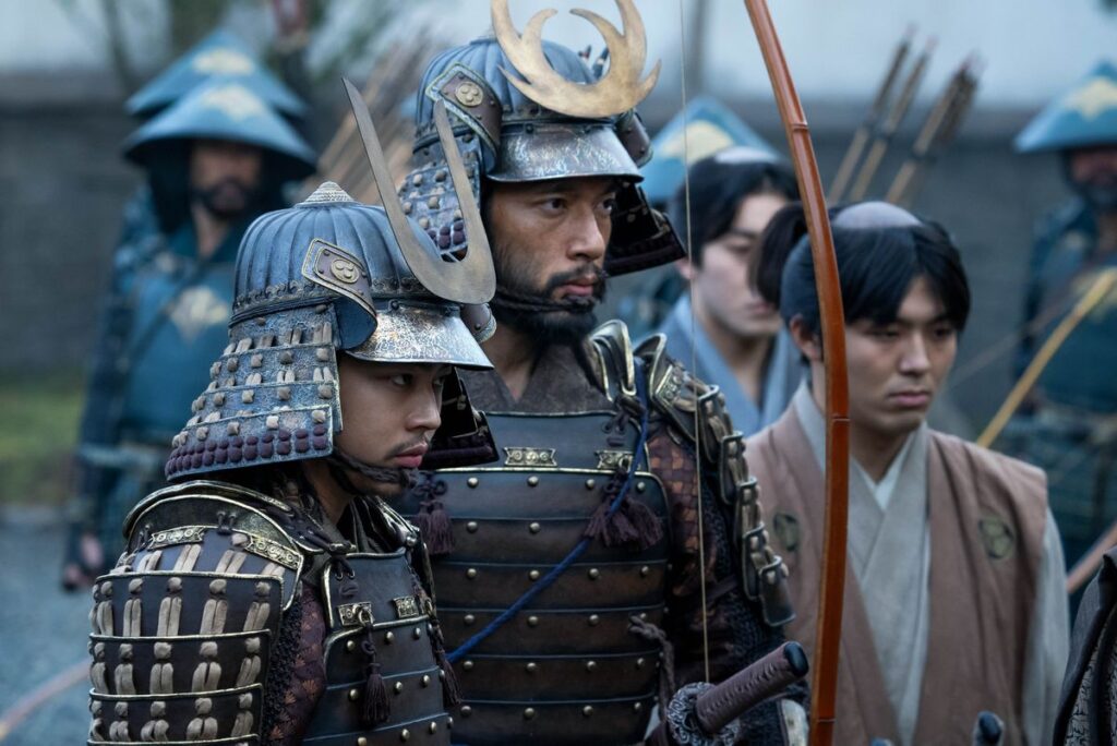 Yuki Kura as Yoshii Nagakado, Shinnosuke Abe as Buntaro stand next to each other in samurai armor in Shogun