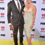 T.J. Holmes, left, and Amy Robach are photographed at the iHeartRadio Music Awards on April 1, 2024, in Los Angeles.