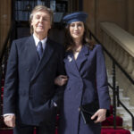 Nancy arrives with Sir Paul at a Buckingham Palace ceremony where he was made a Companion of Honour in May 2018