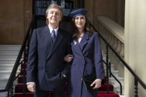 Nancy arrives with Sir Paul at a Buckingham Palace ceremony where he was made a Companion of Honour in May 2018