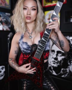 Kiki Wong is a Los Angeles-based musician who was a guitarist in the band Vigil of War and performed with Taylor Swift