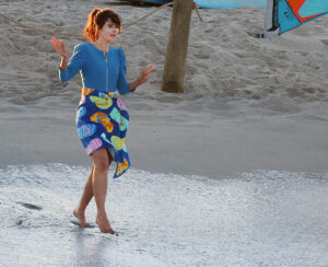 Zooey Deschanel stripped down on the beach while filming for her latest movie