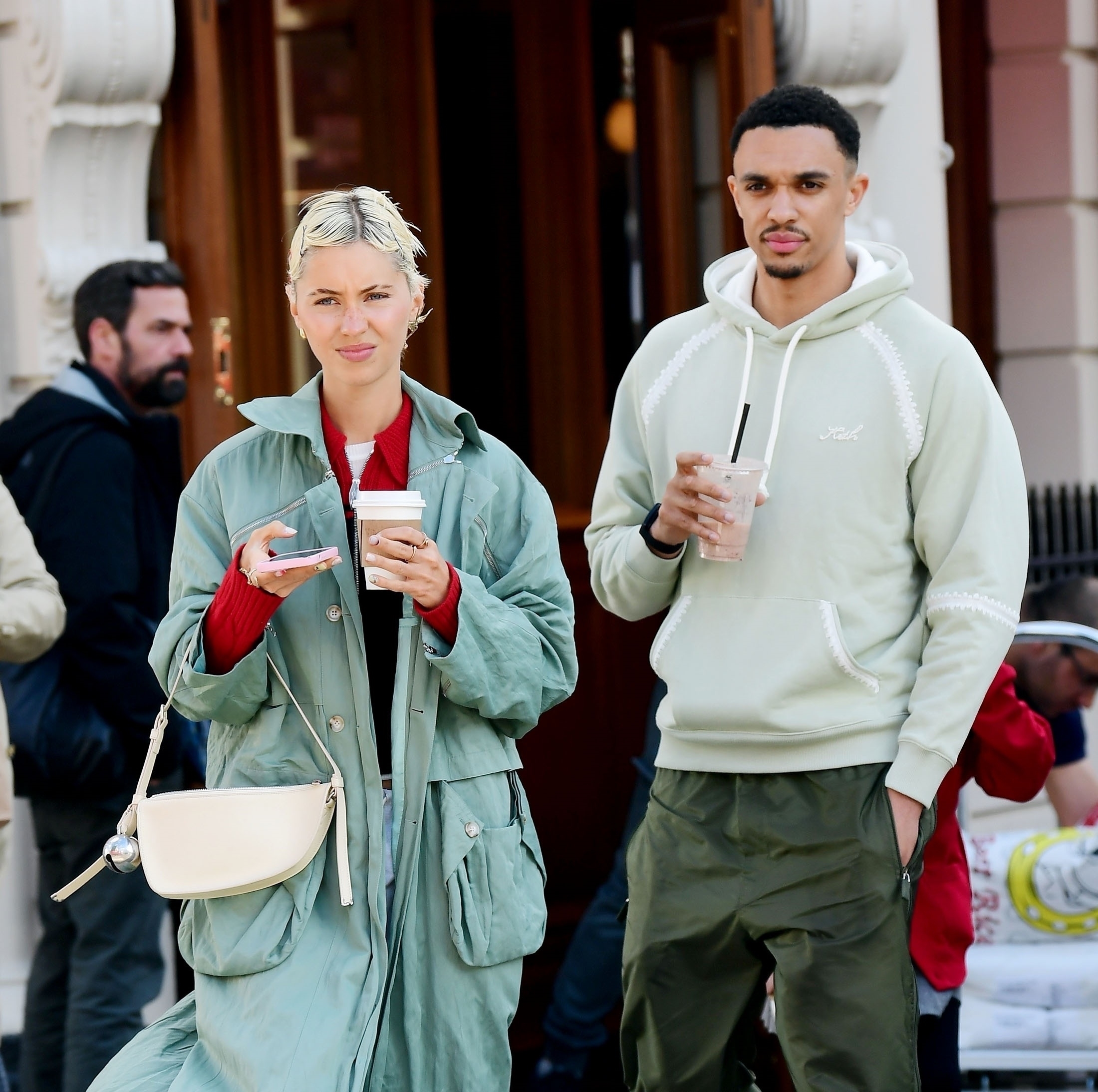 Iris had a coffee cup while Alexander-Arnold had a smoothie in hand