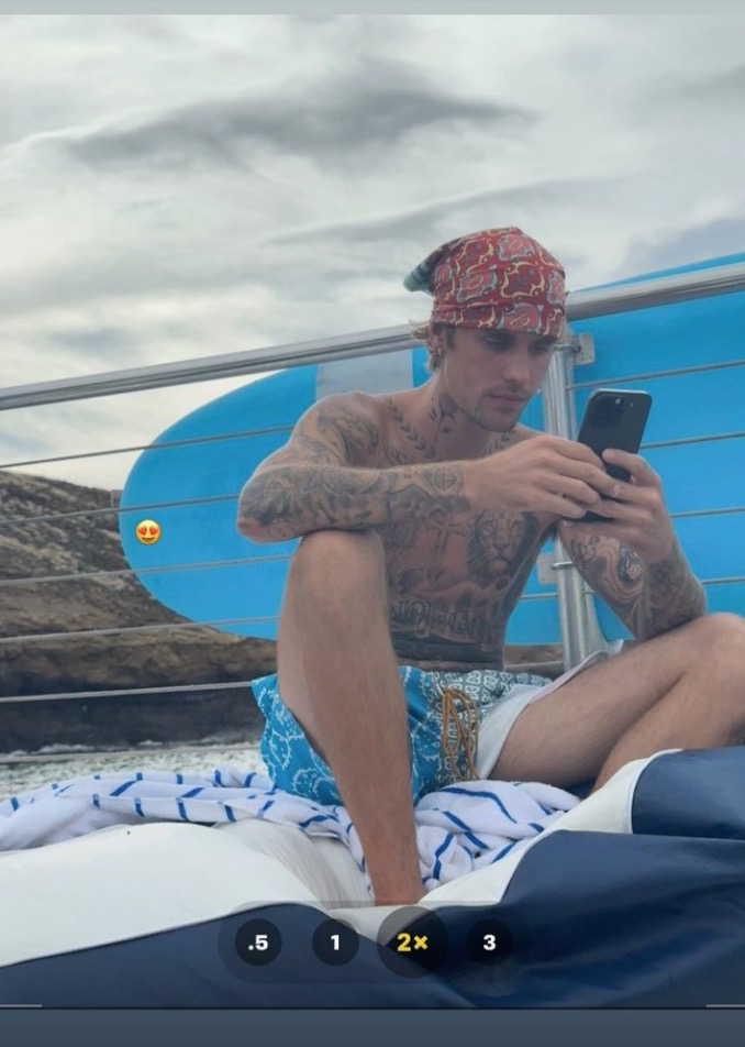 Hailey posted a shirtless pic of Justin looking serious on a boat