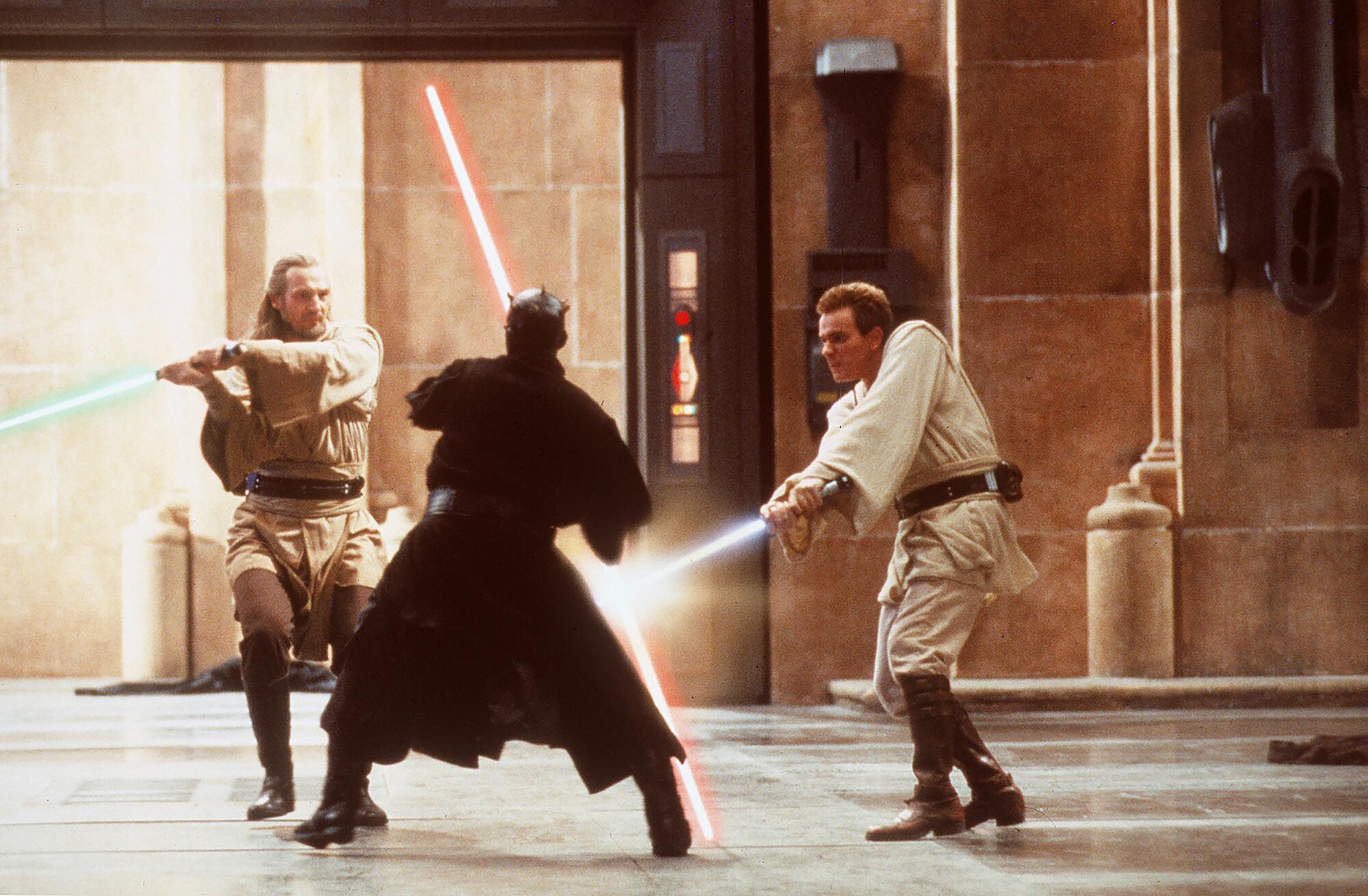 Three warriors engage in a lightsaber duel.