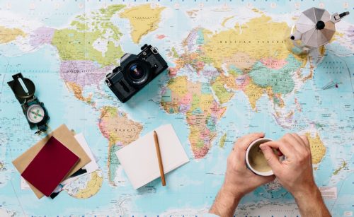 World Map With Camera, Passport and Notebook